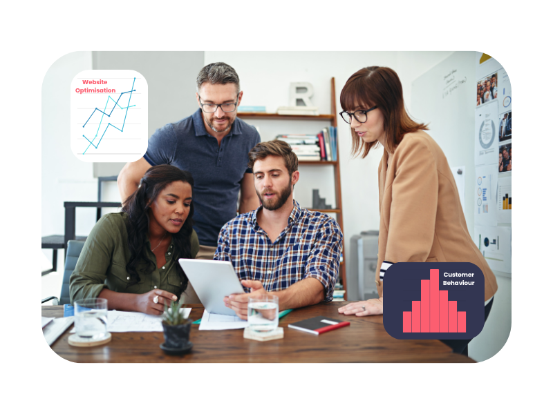 Group of professionals reviewing data on a tablet with customer behaviour and website optimisation charts—representing collaborative learning in a Level 3 digital marketing apprenticeship.