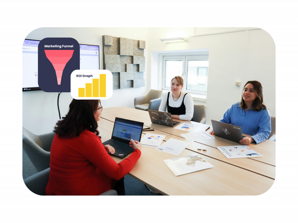 Marketing apprenticeships Birkenhead team discussing marketing funnel strategy and ROI performance in a collaborative office meeting.